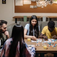 image of men and women playing board game